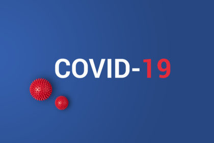Iinscription COVID-19 on blue background with red ball